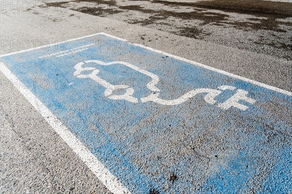 Parking space for an electric car on the beach in Barcelona, Spain, Europe