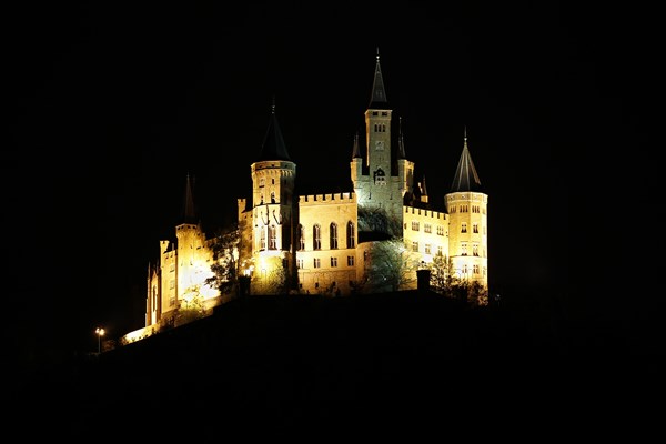 Hohenzollern Castle, ancestral castle of the princely family and former ruling Prussian royal and German imperial house of Hohenzollern, summit castle, historical building by the Berlin architect Friedrich August Stueler, architecture, neo-Gothic, castle building, aristocratic residence, west view, night view, illumination, artificial light, Bisingen, Zollernalbkreis, Baden-Wuerttemberg, Germany, Europe