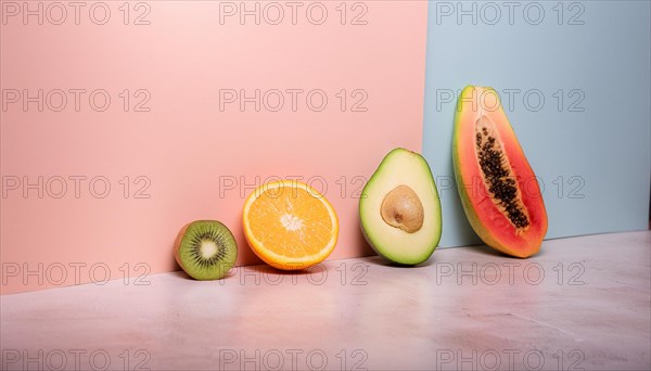 Sliced fruits arranged on a split pastel background, featuring kiwi, orange, avocado, and papaya, horizontal, AI generated