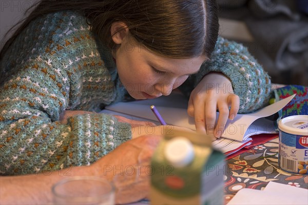 Girl, 10 years old, doing schoolwork, Mecklenburg-Western Pomerania, Germany, Europe