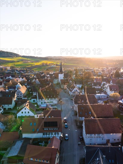 The low sun casts shadows over a quiet city street, Calw, Black Forest, Germany, Europe