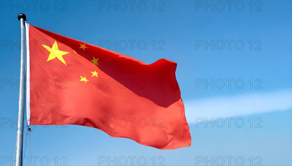 Flag, the national flag of China flutters in the wind