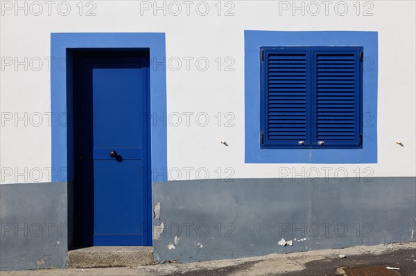 White house facade with blue window and entrance door, Betancuria, Fuerteventur, Canary Island, Spain, Europe