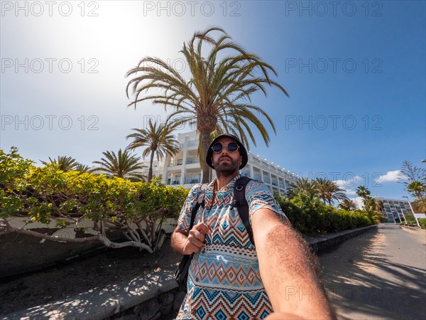 Selfie of tourist walking towards the dunes of Maspalomas, Gran Canaria, Canary Islands