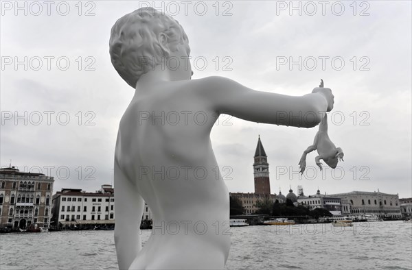 Charles Ray's statue of the boy with a frog on the top of the Zattere, detail of a surrealist sculpture with a white hand holding a frog, Venice, Veneto, Italy, Europe