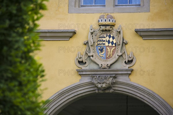 Mythical creature and ducal Wuerttemberg coat of arms above archway, stone figure, face, Winnental Castle built in the 15th century by the Teutonic Knights as the seat of the Winnender Kommende, former castle of the Teutonic Order, today Winnenden Castle Clinic Centre for Psychiatry, castle building, historical building, architecture, Winnenden, Rems-Murr-Kreis, Baden-Wuerttemberg, Germany, Europe