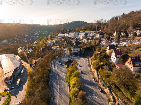 View of a busy intersection in the glowing evening light with hospital, Calw, Black Forest, Germany, Europe