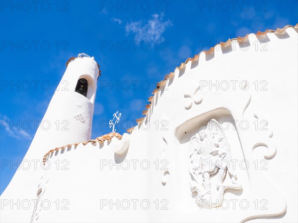 Stone sculpture, St George as dragon slayer, relief on the facade of the Stella Maris church, Porto Cervo, Costa Smeralda, Sardinia, Italy, Europe