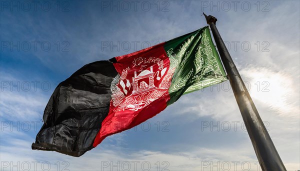 Flag, the national flag of Afghanistan flutters in the wind