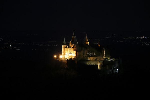 Hohenzollern Castle, ancestral castle of the princely family and former ruling Prussian royal and German imperial house of Hohenzollern, summit castle, historical building by the Berlin architect Friedrich August Stueler, architecture, neo-Gothic, castle building, aristocratic residence, south view from the Zellerhorn, night view, illumination, artificial light, Bisingen, Zollernalbkreis, Baden-Wuerttemberg, Germany, Europe