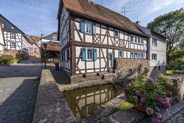 Former mill on the Muehlgraben, historic half-timbered house from around 1709, cultural monument, listed building, old town, Ortenberg, Vogelsberg, Wetterau, Hesse, Germany, Europe