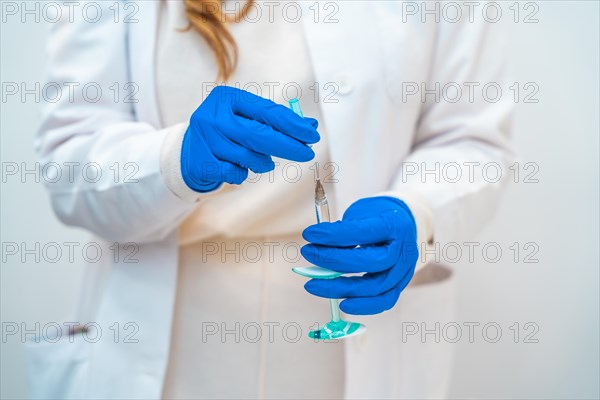 Close-up of an unrecognizable female doctor holing a collagen injection in an aesthetic clinic