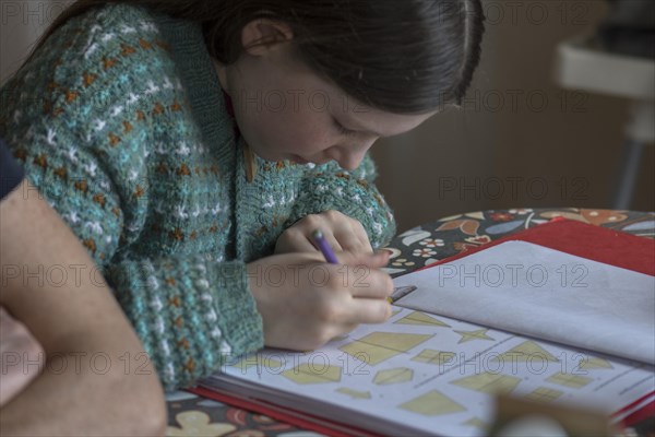 Girl, 10 years old, doing schoolwork, Mecklenburg-Western Pomerania, Germany, Europe