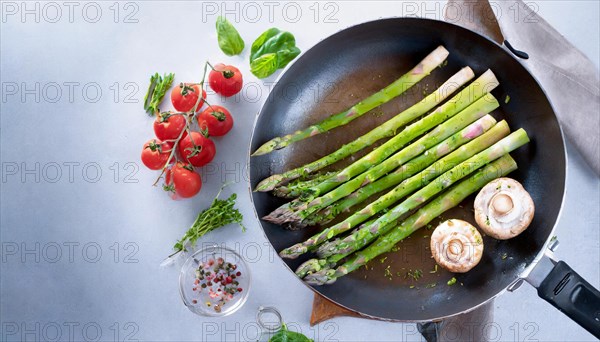 Fresh asparagus arranged in a pan with mushrooms and tomatoes on a cloth, green asparagus, asparagus spears, KI generated, AI generated
