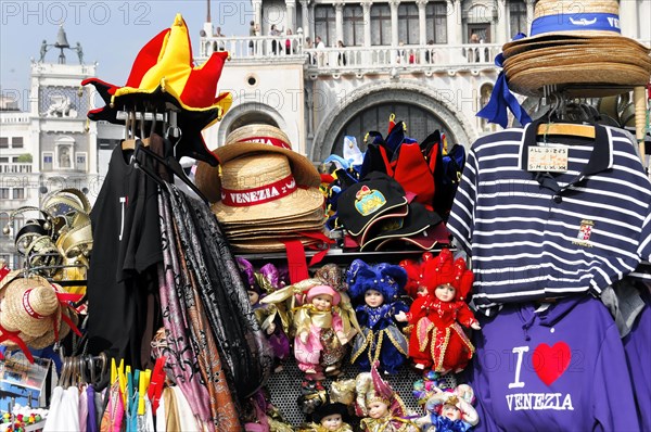 Colourful souvenir stall in Venice with hats, masks and striped shirts, Venice, Veneto, Italy, Europe
