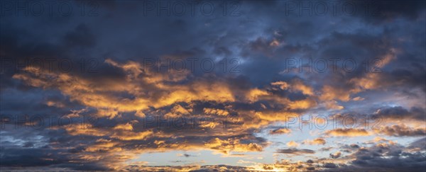 Dramatic storm clouds in the morning light, panorama, wallpaper, sky replacement