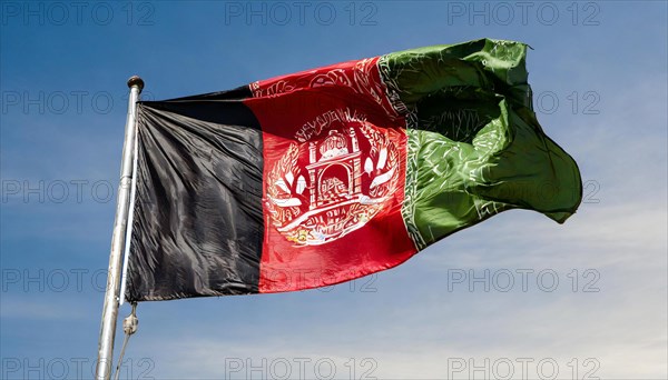 Flag, the national flag of Afghanistan flutters in the wind