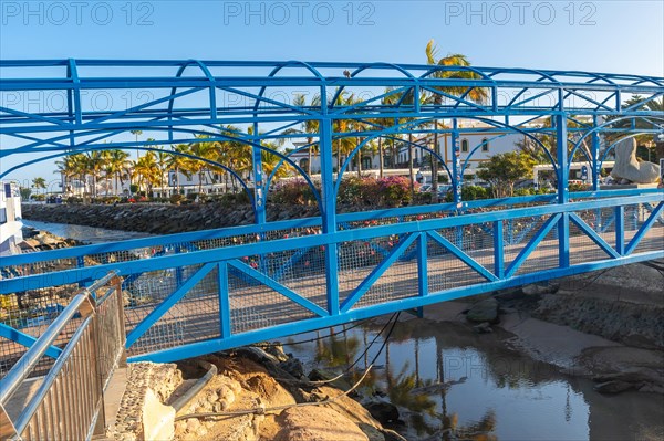 A bridge over the river in the port of the touristic coastal town Mogan in the south of Gran Canaria. Spain