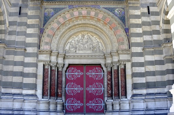 Marseille Cathedral or Cathedrale Sainte-Marie-Majeure de Marseille, 1852-1896, Marseille, Historic church door with Gothic architecture, surrounded by mosaics and ornamented columns, Marseille, Departement Bouches-du-Rhone, Region Provence-Alpes-Cote d'Azur, France, Europe