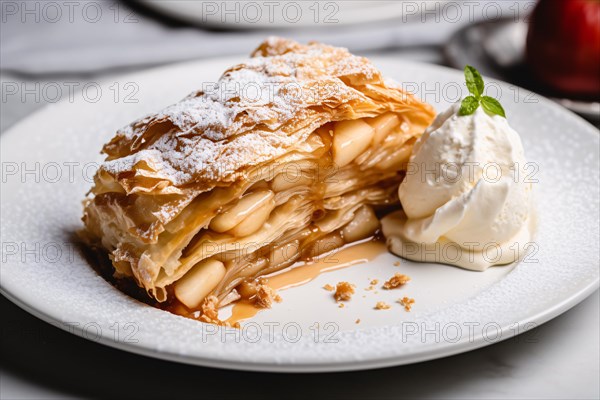 Apple strudel with whipped cream on plate. KI generiert, generiert, AI generated