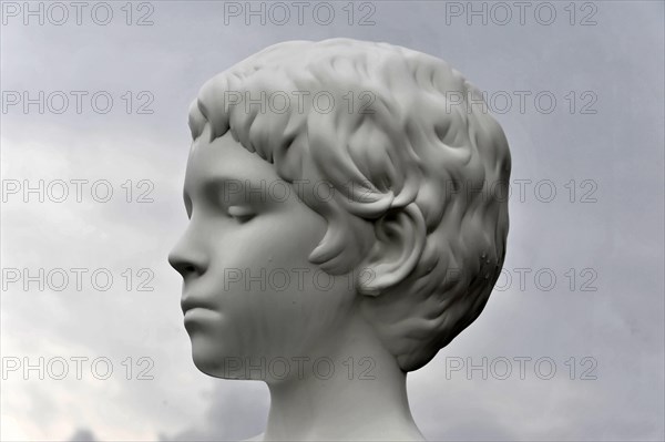 Charles Ray's statue of the boy with frog on top of the Zattere Portrait of a classical bust of a boy in white marble with detailed strands of hair, Venice, Veneto, Italy, Europe