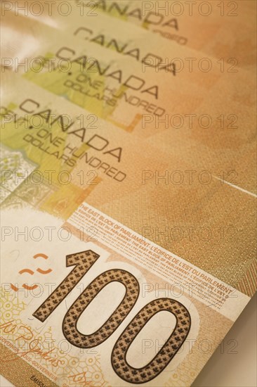 Close-up of brown Canadian Bank of Canada one-hundred dollar bank notes, Studio Composition, Quebec, Canada, North America
