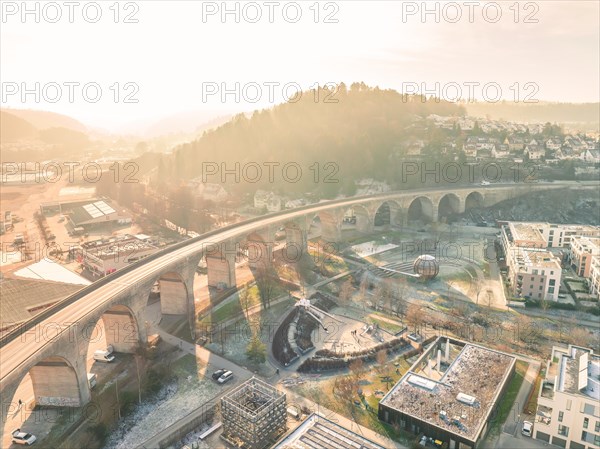 Morning town with bridge and sunbeams illuminating the buildings, Sunrise, Nagold, Black Forest, Germany, Europe