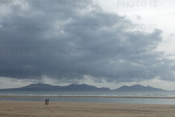 Beach, people, clouds, mountains, LLanddwyn Bay, Newborough, Isle of Anglesey, Wales, Great Britain