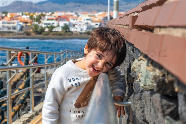 Portrait of a boy smiling on summer vacation seaside