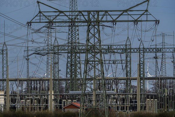 Stendal West substation with wind turbines in the background near Luederitz, Stendal, Saxony-Anhalt, Germany, Europe