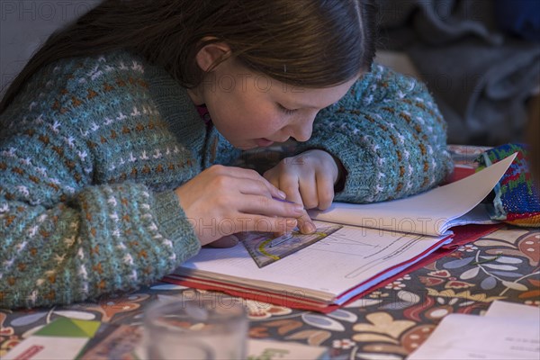 Girl, 10 years old, doing schoolwork, Mecklenburg-Western Pomerania, Germany, Europe