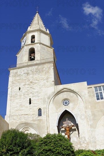 Old church tower with a cross, in front of a clear blue sky, Marseille, Bouches-du-Rhone department, Provence-Alpes-Cote d'Azur region, France, Europe