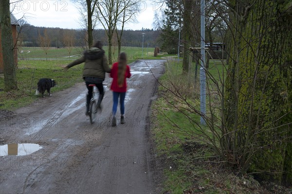 Girl riding a unicycle, motion blur, Mecklenburg-Vorpommern, Germany, Europe