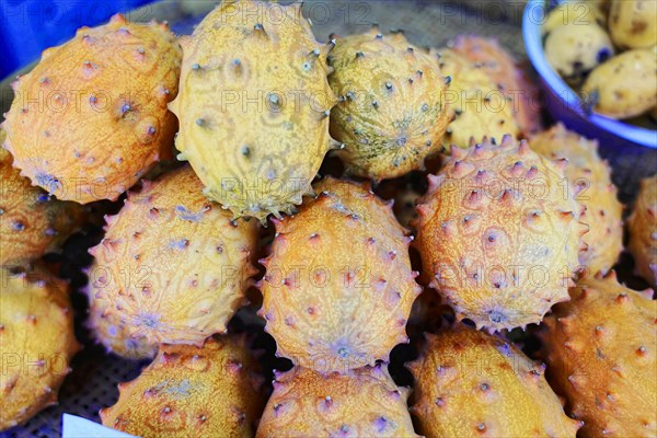 Supermarket, vegetable market in the centre of Shanghai, China, Asia, Asia, close-up of stacked kiwanos, also known as horned melons, Shanghai, Asia