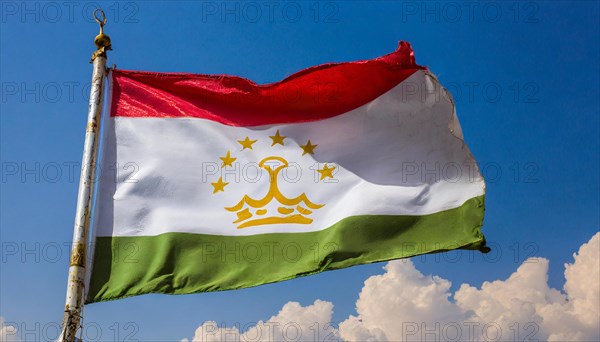 The flag of Tajikistan, fluttering in the wind, isolated, against the blue sky