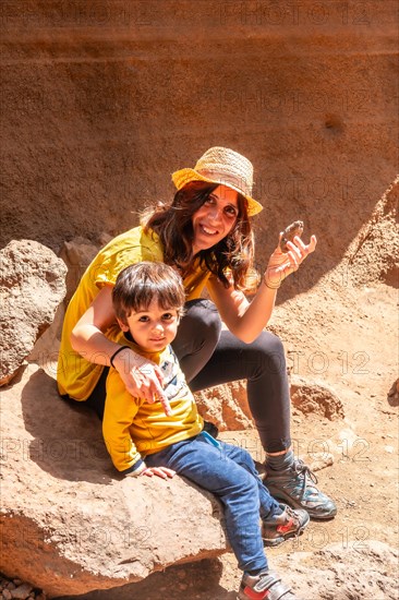 Family enjoying in the limestone canyon Barranco de las Vacas in Gran Canaria, Canary Islands