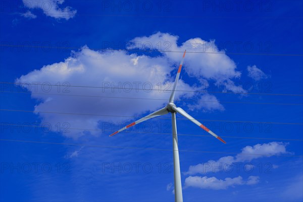 Wind turbine and high-voltage lines at the Avacon substation in Helmstedt, Helmstedt, Lower Saxony, Germany, Europe