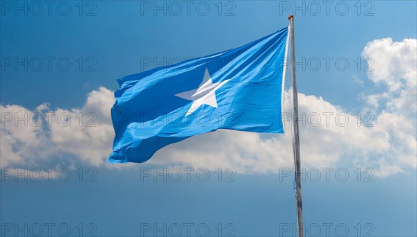 The flag of Somalia, fluttering in the wind, isolated, against the blue sky
