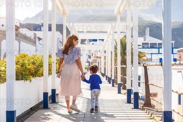 A mother with her son on vacation at Puerto de Las Nieves in Agaete on Gran Canaria, Spain, Europe