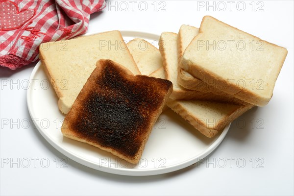 Burnt slice of toast with toast, toast