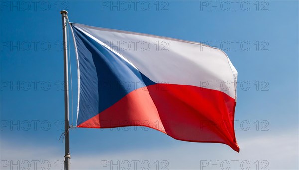 The flag of Czechia, Czech Republic, Czech Republic, fluttering in the wind, isolated against a blue sky, Europe