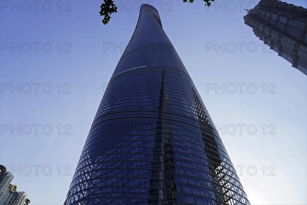 Jin Mao Tower, nicknamed The Syringe at 420 metres and the 632-metre Shanghai Tower, nicknamed The Twist, Shanghai, People's Republic of China, A glass skyscraper reflects the sky in its facade, Shanghai, China, Asia