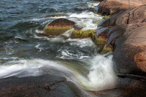 Red granite, rocky coast, surf, long exposure, Havsvidden, Geta, Aland, Aland Islands, Finland, Europe