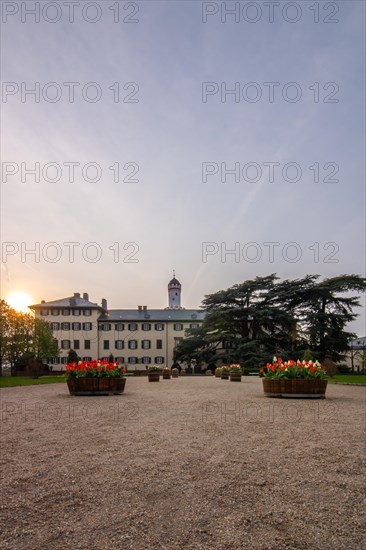 A castle with park at sunset. Historic building. Summer residence of the Prussian kings and German emperors in Bad Homburg, Hesse, Germany, Europe