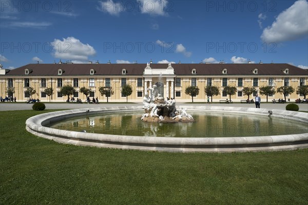 Right side building with fountain of Schoenbrunn Palace, Vienna, Austria, Europe