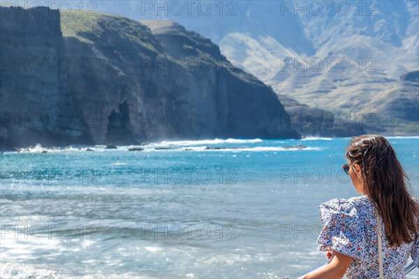 A woman on the beach of Puerto de Las Nieves in Agaete on Gran Canaria, Spain, Europe