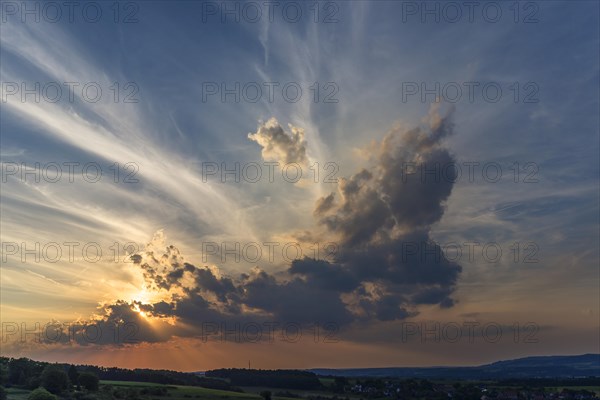 Sun and clouds in the evening sky, Middle Franconia, Bavaria, Germany, Europe
