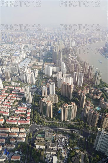 View from the 632 metre high Shanghai Tower, nicknamed The Twist, Shanghai, People's Republic of China, Vertical shot of skyscrapers, residential areas and green spaces in a city, Shanghai, China, Asia