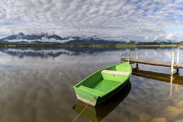 Rowing boat at sunrise, Hopfensee, Hopfen am See, near Fuessen, Ostallgaeu, Allgaeu, Bavaria, Germany, Europe