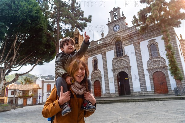 Family tourism visiting the Basilica of Nuestra Senora del Pino in the municipality of Teror. Gran Canaria, Spain, Europe